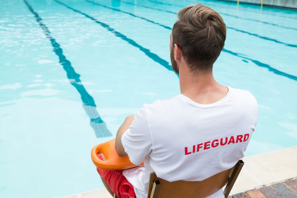 bigstock-rear-view-of-lifeguard-sitting-184572139-1024x683