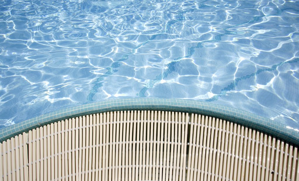 bigstock-swimming-pool-sun-reflections-25612091-1024x621