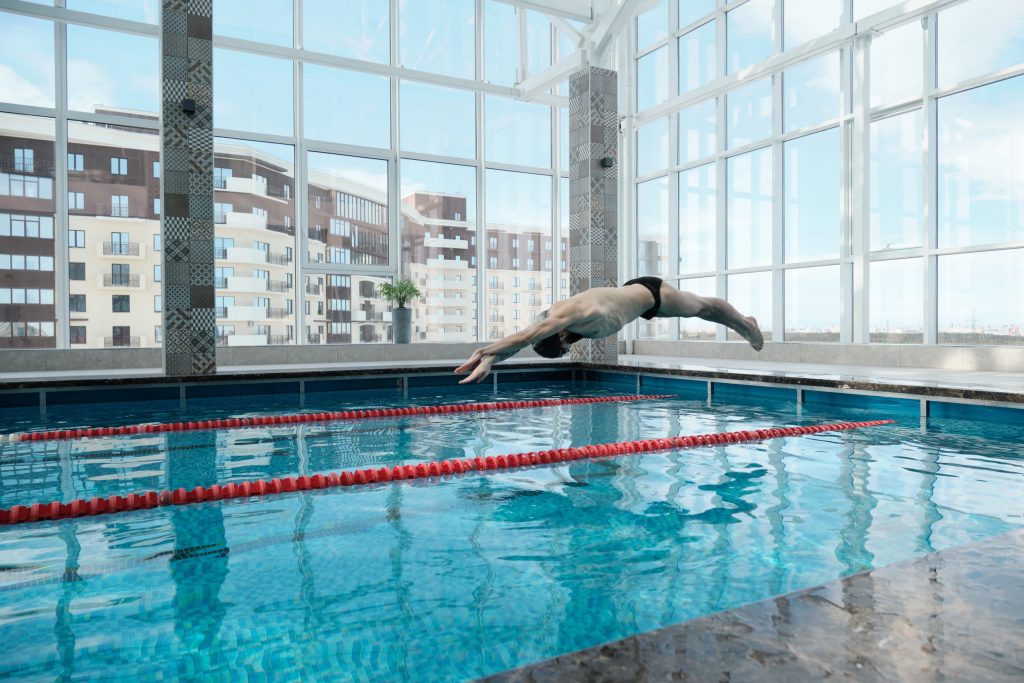 jumping-in-swimming-pool-n2elk5f-scaled-1024x683
