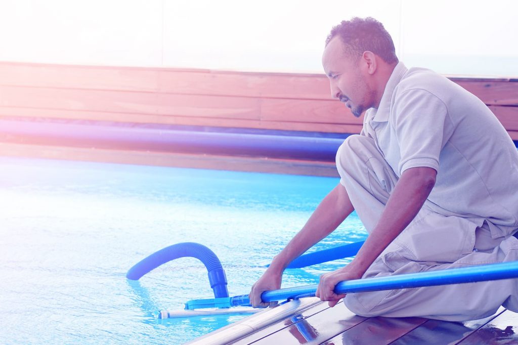 bigstock-pool-cleaner-during-his-work-249174202-1024x682