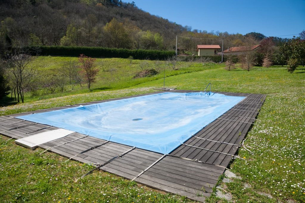 bigstock-pool-closed-in-green-meadow-163711208-1024x683