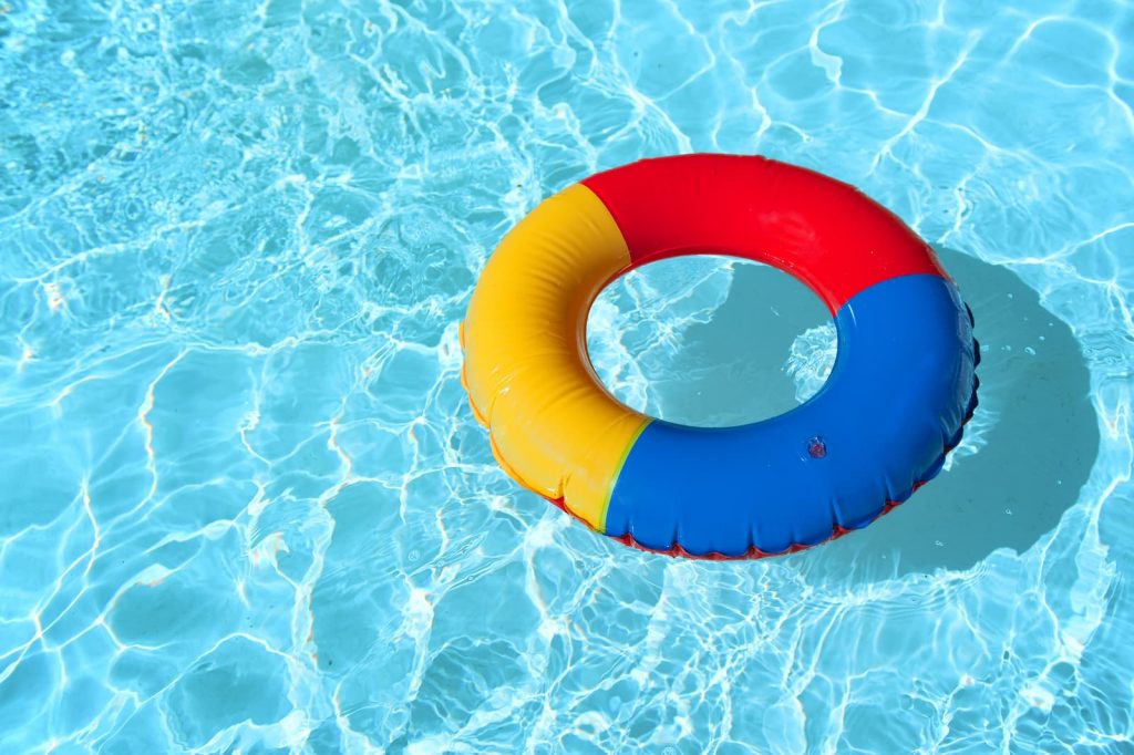 bigstock-swimming-pool-with-floatable-t-15628721-1024x682