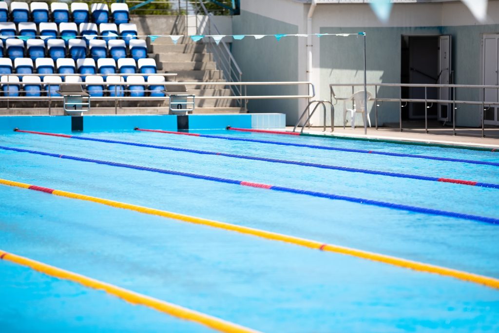 bigstock-empty-swimming-pool-with-compe-352094780-1024x683