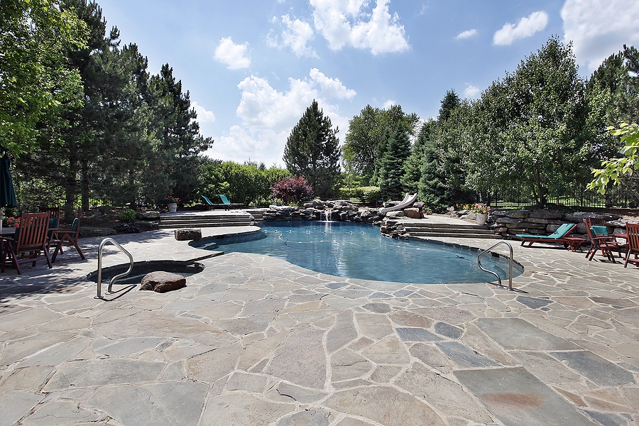 bigstock-swimming-pool-with-large-stone-7213580