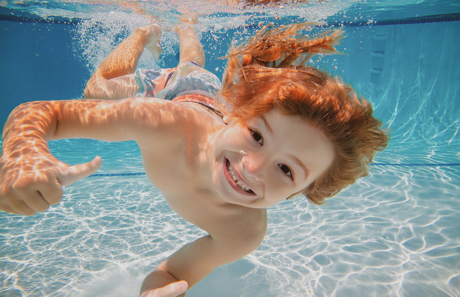 bigstock-happy-kid-boy-swim-and-dive-un-445749761-1