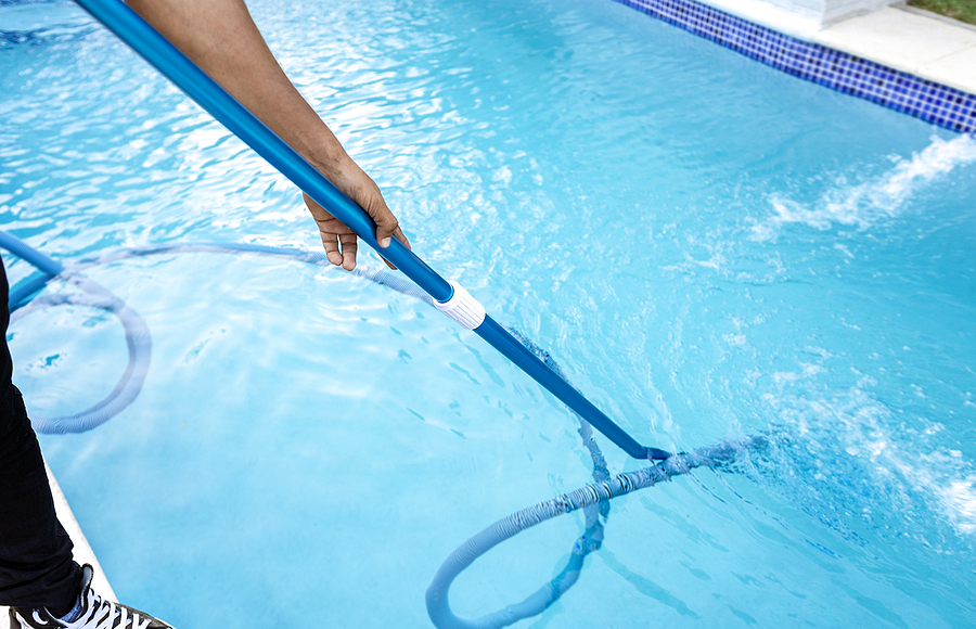 bigstock-pool-maintenance-and-cleaning-469202051