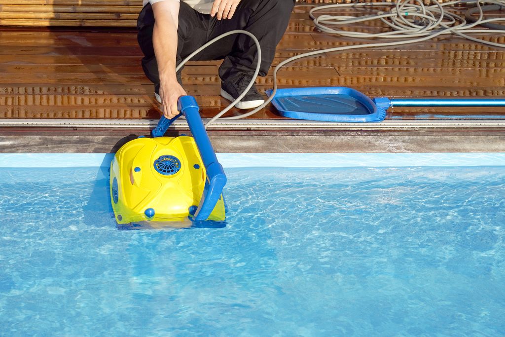 bigstock-pool-cleaner-during-his-work-320582842-1024x683