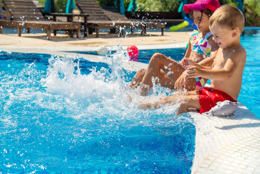 children-splash-their-feet-in-the-pool-selective-2024-12-19-12-18-02-utc-scaled-1024x683